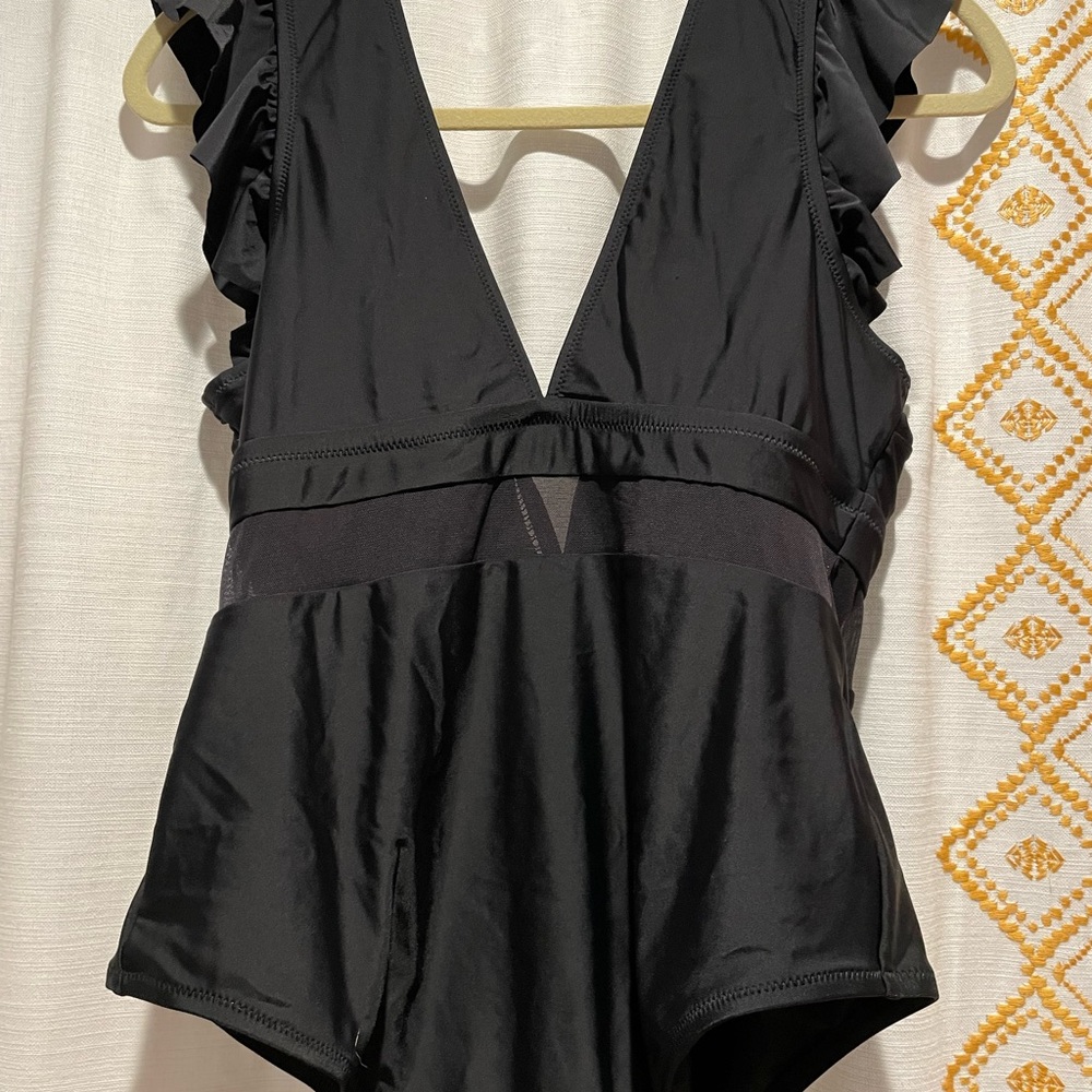 Cupshe  woman’s black bathing suit.